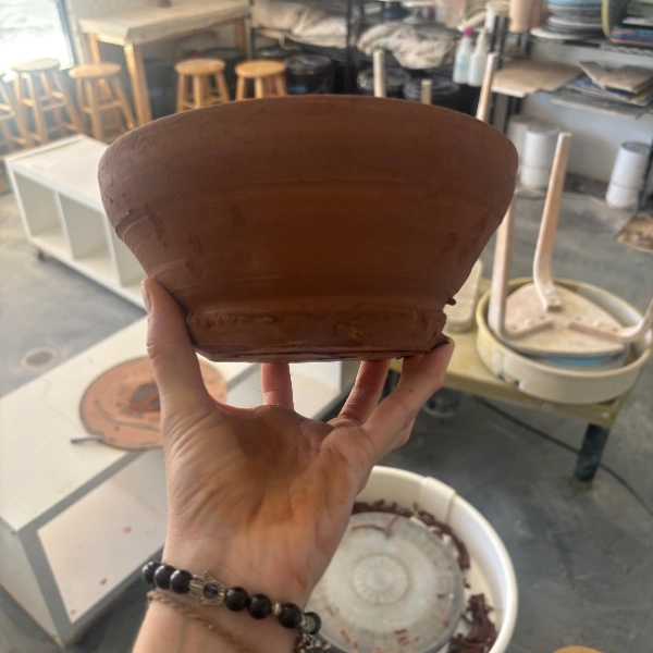 ceramic bowl ready to be trimmed in a pottery studio